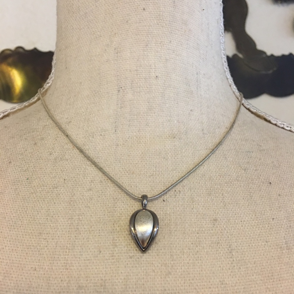 Silver tone teardrop pendant on snake chain